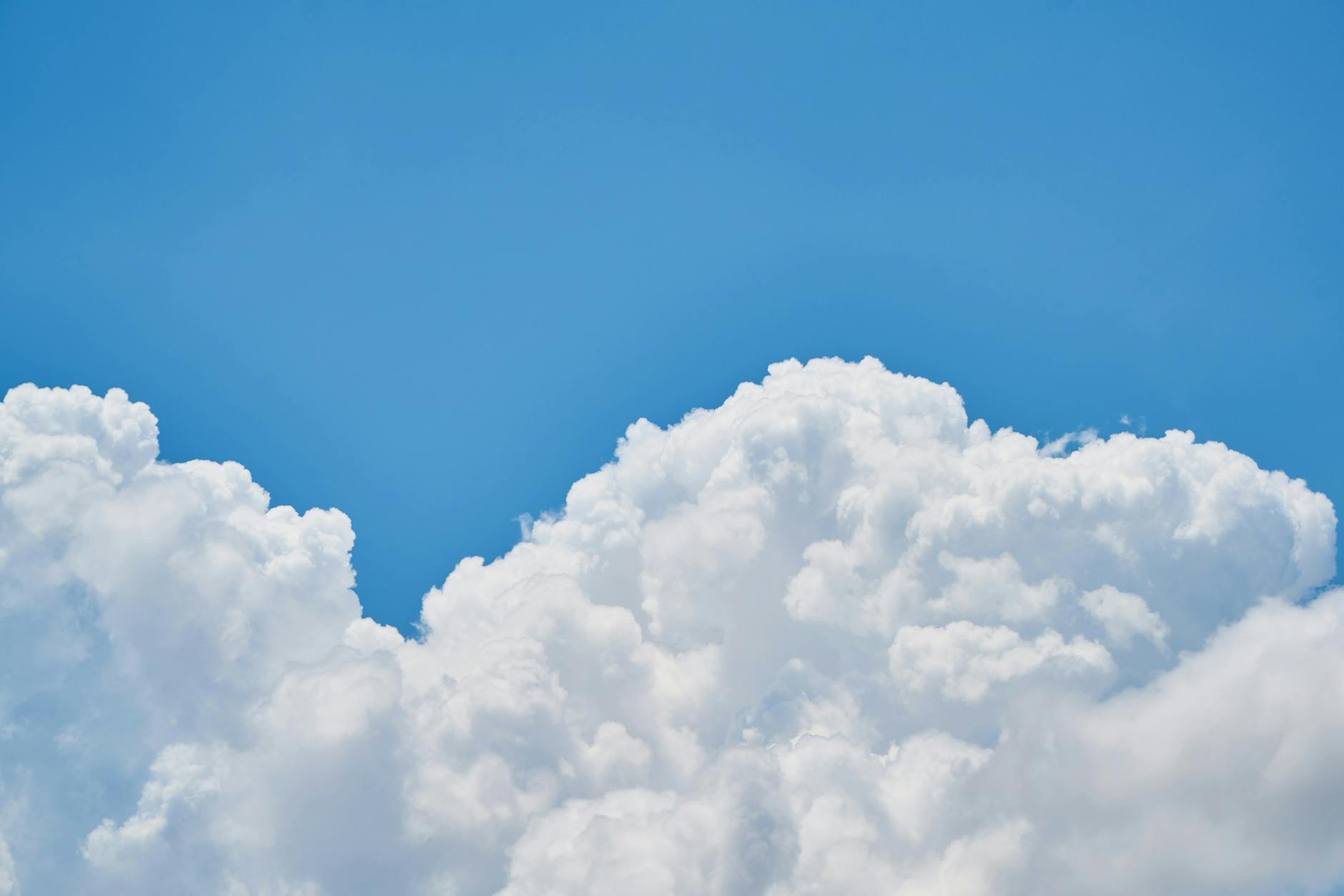 blue sky with fluffy white clouds